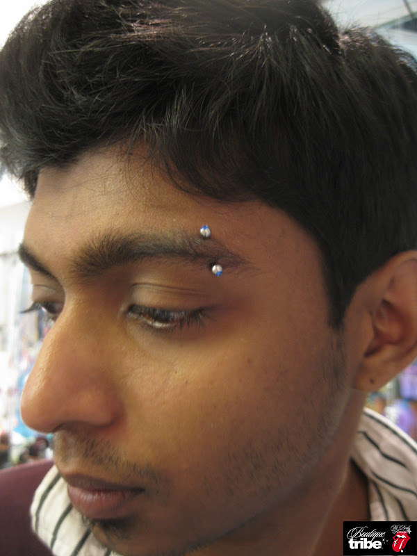 Eyebrow piercing title=