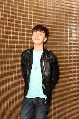 Greyson Chance up against the wall