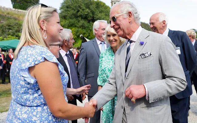 The Duchess of Cornwall wore a flower silhouette drawstring maxi dress from Me + Em