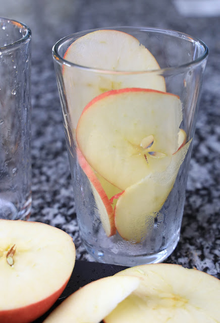 apple slices in a clear glass.