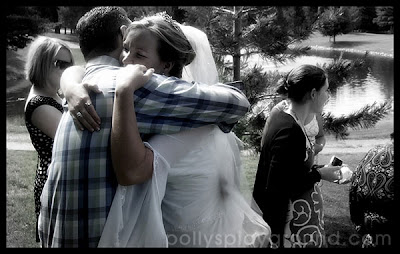 hugging the bride