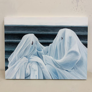 A photorealistic painting of two bedsheet ghosts sitting next to each other, one seems to be comforting the other. By Maria Kvam.