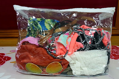 bed-sheet package used as a clothing organizer for travelling