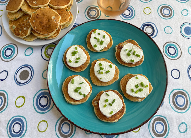 Food Lust People Love: Bacon Potato Silver Dollar Pancakes are made with mashed potato, crispy bacon and green onions, stirred into pancake batter and cooked on a griddle until golden. These make an excellent breakfast, snack or serve them as an appetizer, topped with a slice of goat cheese and a sprinkle more of green onion. So good!