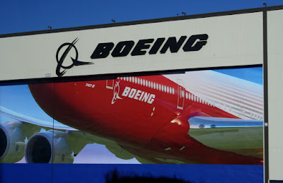 Boeing sign displayed on the back of a Boeing jet