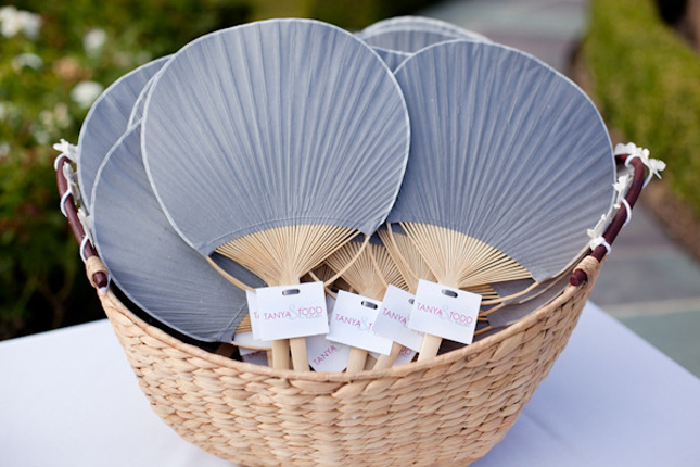  personalized paper fans with the wedding program or a thank you note