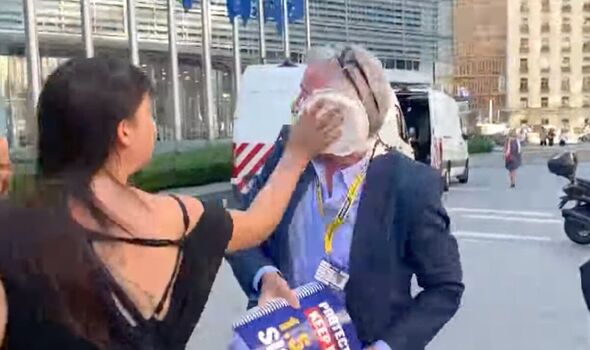 Environmentalists hit Ryanair boss with cream pies at EU headquarters