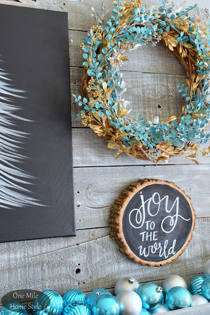 Black and White Joy to the World Wood Slice Art with Silver and Blue Christmas Ornaments and Wreath | Christmas Home Tour - One Mile Home Style