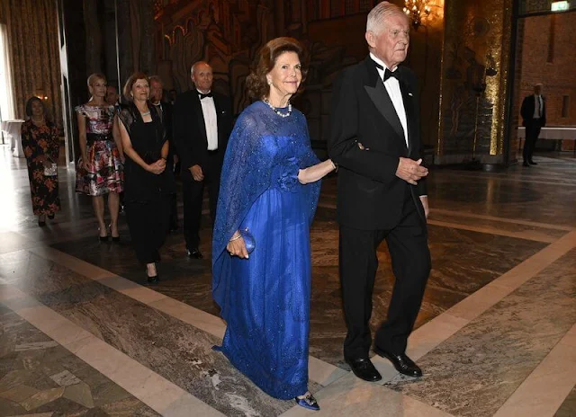 Queen Silvia wore a royal blue tulle gown. Manolo Blahnik Hangisi embellished royal blue satin pumps. Professor Wilfried Brutsaert