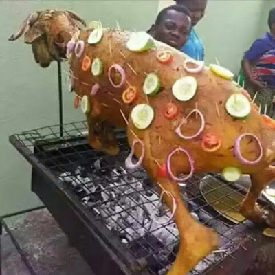 GOAT BEING ROASTED DURING Sallah Nigerian style!