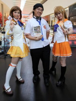 Looking the part: Anime fan Joshua Lee (centre), 29, who made his own costume, with Hammi Lye (left), 23, and Jennifer Thum, 26, all dressed in Mirai Millenium costumes.