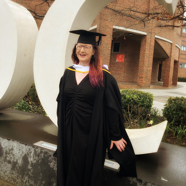 Picture of Cliona in gown and cap at Master's graduation in DCU