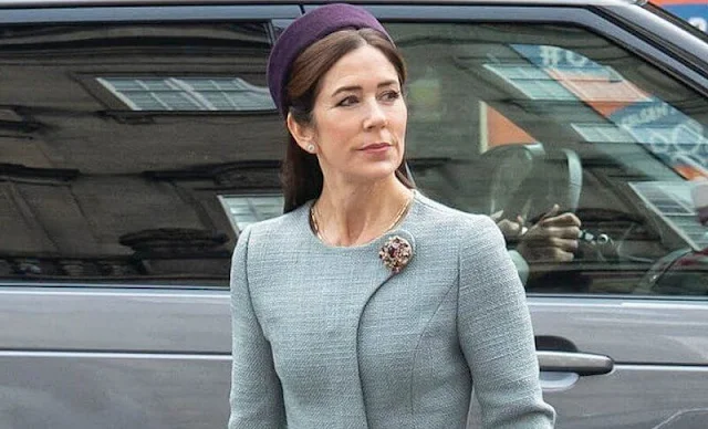 Crown Princess Mary wore a pale blue coat by Claes Iversen. Gianvito Rossi pumps. Jane Taylor purple hat