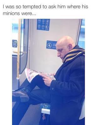 Man on bus, looking like Gru from the animated movie 'Despicable Me'.