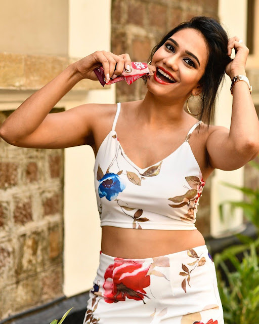 Ruchi Shah radiates confidence in a chic short dress, showcasing her bold style.