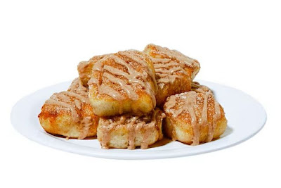 A plate of Cicis Pumpkin Spice Cinnamon Rolls.