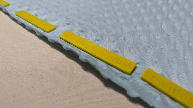 SewTites magnets holding minky fabric onto the longarm