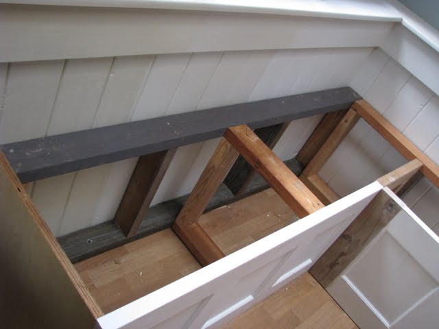 blue roof cabin: Salvaged Door into a Dining Room Banquette