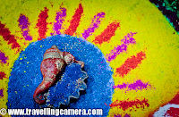 Diwali Rangoli,Art at Adobe, Rangoli is a traditional decorative folk art of India. These are decorative designs made on floors of living rooms and courtyards during Hindu festivals and are meant as sacred welcoming areas for the Hindu deities. The ancient symbols have been passed on through the ages, from each generation to the one that followed, thus keeping both the art form and the tradition alive. Rangoli and similar practices are followed in different Indian states; in Tamil Nadu, one has Kolam, Madanae in Rajasthan, Chowkpurna in Northern India, Alpana in Bengal, Aripana in Bihar, and so on. The purpose of Rangoli is decoration and it is thought to bring good luck. Teams make rangolis every year before Diwali at Adobe. However, this time the patterns were incredibly intricate and imaginative.Om is the sacred symbol of Hinduism, Buddhism, and Jainism and can often be seen in religious arts. Rangoli is no exception.The traditional rending of a new bride in a Doli. In medieval and ancient India and for a long time even in modern India, after marriage, dolis bourne on the shoulders of 4-6 men were used to transport the new bride to her husband's home. Marigold flowers (गेन्दा) are inseparable from Hindu Prayers and religios decorations. Idols of Deities are often adorned with garlands of marigold flowers and red roses.This is a clever integration of a peacock in the face of Lord Ganesh. While the peacock is the greatly revered in Hindu Scriptures, Lord Ganesh is the deity who the Hindus rely upon to take care of new entreprises. Beautiful colors and image! The peacock is also the National Bird of India.A pattern with the peacock in the center and outlined with marigold and rose petals.A Peacock is often referred to as a bird with a hundred eyes owing to the eye-like patterns in its tail feathers. The Kalash (a brass pot) is a symbol of abundance in Hinduism. It is often worshipped during the yagyas along with the deities in Arya Samaj branch of Hinduism. Full rendering of a peacock on the branch of a flowering plant with symbols of various Adobe Products in its tail. It is holding a scroll with the symbol of Adobe and the Sacred Swastik in its beak. Swastik, contrary to common knowledge, is an ancient holy symbol in Hinduism. Unfortunately, it was used by Nazis and after that the real, holy meaning seems to have been lost to the world. But in India, it is still used with a lot of respect in almost all religious ceremonies.  Lord Ganesh with his elephant head and human body. Lord Ganesh is widely worshipped along with Goddess Lakshmi (the Godess of Wealth) during diwali. Lord Ganesh, himself, is considered to be the God of New Beginnings, someone who removes hurdles. Another colorful design with the logos of various Adobe products, You can see the well know photoshop, Premiere Pro, Dreamweaver, Acrobat, InDesign etc.Diya's (earthen lamps) are used during diwali to decorate houses and businesses. They are shallow vessels made of clay or brass and have a cotton wick dipped in mustar oil.This design is more traditional with Om and a stark white color against a bright red. Two peacocks with their royal blue necks and bright green plumage. Peacocks seemed to rule the designs this year. A new age Ganesh with his vehicle, a mouse. If you look closely, the mouse if offering him an Apple that looks strikingly similar to the logo of the Software Giant of the same name. While the word Adobe has been written in a calligraphic script at the top. Cheeky!A close-up of the Kalash. This one is earthern but has been paited over with a metallic paint. Around it are typical colors of Hinduism, saffron and yellow. A close-up of the calligraphic Adobe.  Baby Ganesh, floating on a cloud, over a colorful carpet of Adobe Products. Whether this cloud is a spiritual cloud or the technical cloud, is open to interpretations. Another colorful and elaborate design with Ganesh and Swastik, The shape of a mango is another common shape in Indian arts. You'll find it used in abundance in mehndis (henna tattoos) and rangolis.Photoshop, flash, Dreamweaver, Bridge and other Adobe products around an Adobe symbol. A fancy earthen Diya full of blue rangoli color.Lord Ganesh, in his various forms, has inspired many artists. And as a result, his form has been used extensively in all kinds of arts, starting from Rangoli to paintings to sculpting. Simple, yet pretty.Adobe employees admiring one of the rangolis. Elephant, another symbol of Hinduism. This one's a tusker and is carrying Adobe on its back. Elephants are closely related to Lord Ganesh. The Rangolis are as colorful as Adobe itself. This particular Rangoli is of a dancing Lord Ganesh.Happy Diwali,  Rangoli, Art,  hinduism, Ganesh, Om, Religion, Art, Colorful