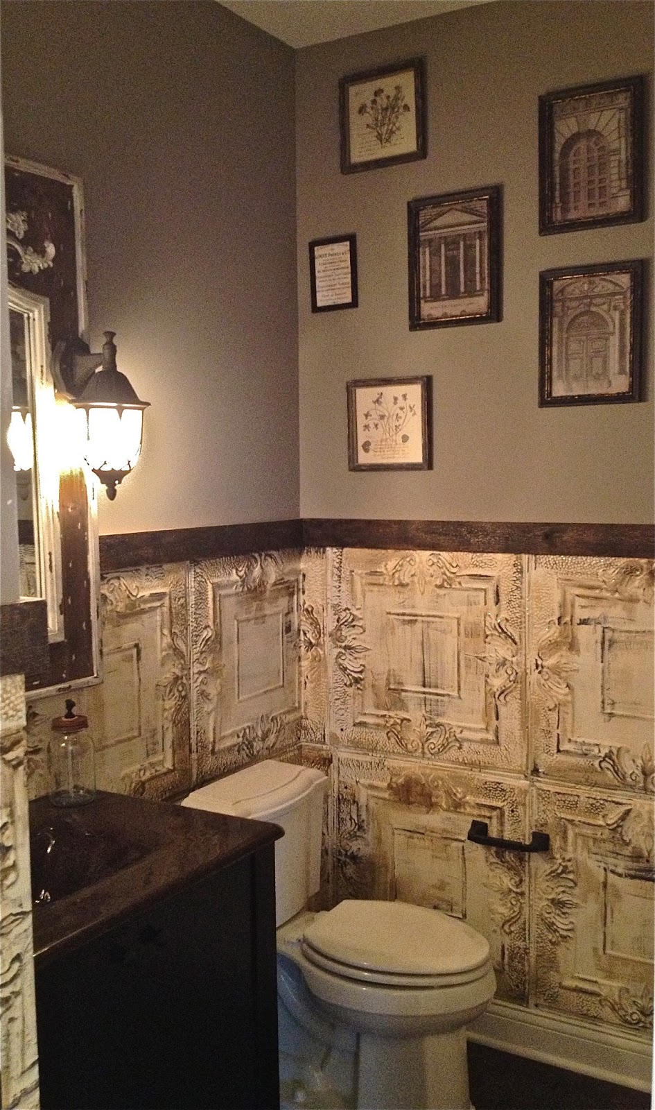 Powder room with vintage ceiling tiles and accented at the top with a 