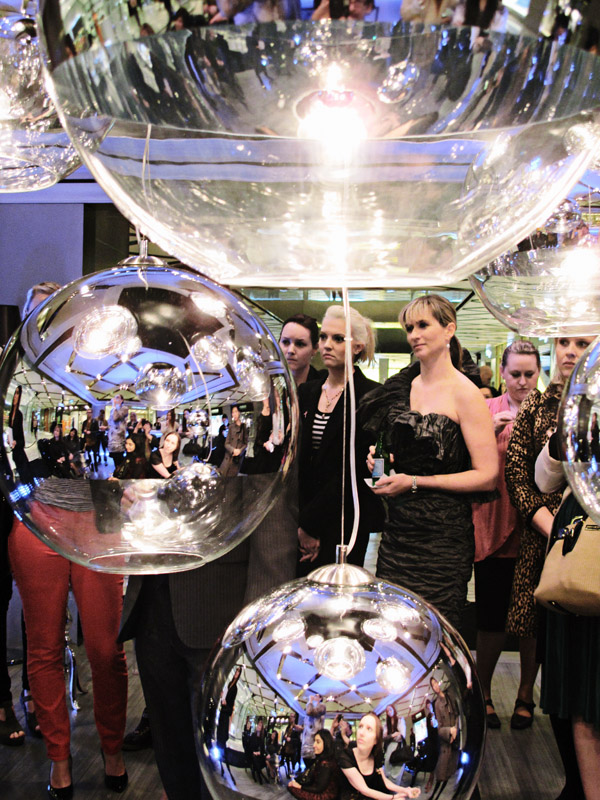 Pommery Champagne Cube Westfield Sydney, Retro Mirror Ball lights, and crowd listening to the launch speeches.