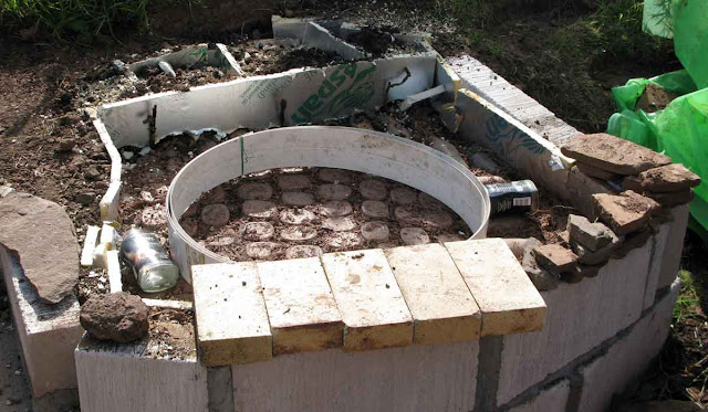 Preparing to make clay pad for oven base.