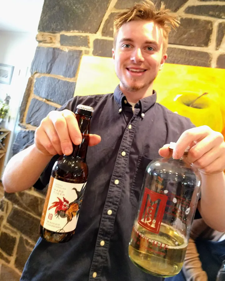 Son Asher McRitchie displays cider choices