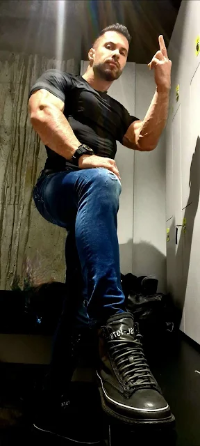 Black Leather boot Cocky Muscle Master Giving the Finger Curated by Oregonleatherboy