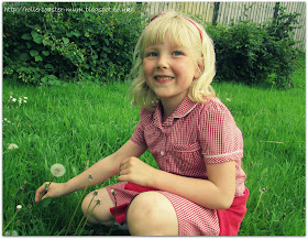 picking a dandelion clock