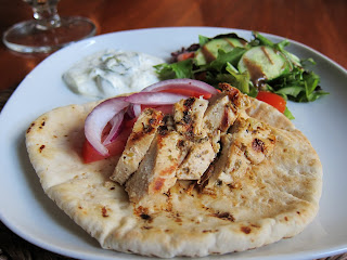 Chicken Gyro on pita with tomatoes, red onion, salad and tzatziki sauce