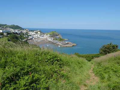 View across harbour from between two grassy mounds