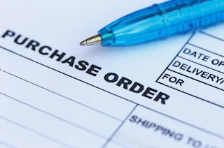 Picture of purchase order form and pen