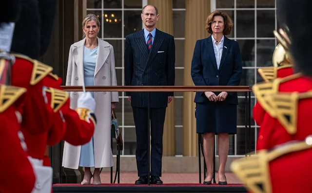 The Duchess of Edinburgh wore a Custodi double breasted brushed wool coat by Max Mara, and sky blue midi dress