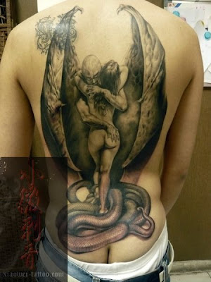 A demon with two wings, a naked girl, and a snake or just the tail?