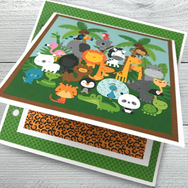 Zoo or Jungle themed scrapbook album page with lots of cute animals, prints, & palm trees