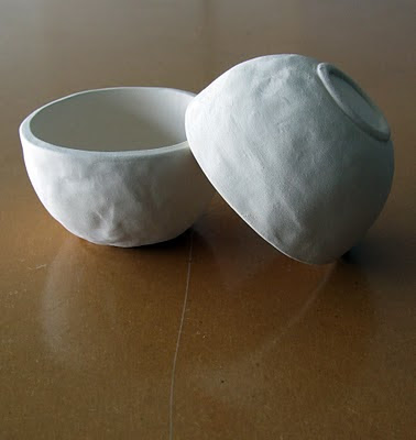 Image of two small thick walled bowls