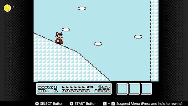 NES-NSO screen shot from Suepr Mario Bros. 3. Mario is sitting down sliding down a curved white hill.