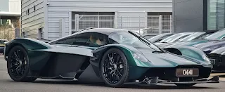 "Aston Martin Valkyrie in a sleek side-angle view showcasing its aerodynamic design."