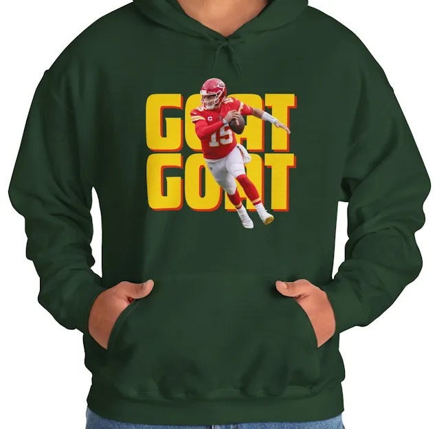 A Hoodie With NFL Player Patrick Mahomes Running Holding The Duke and GOAT Text In The Background