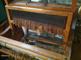 brown thrums hanging on the loom