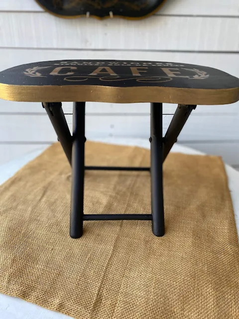 Photo of stool with gold metallic paint edges