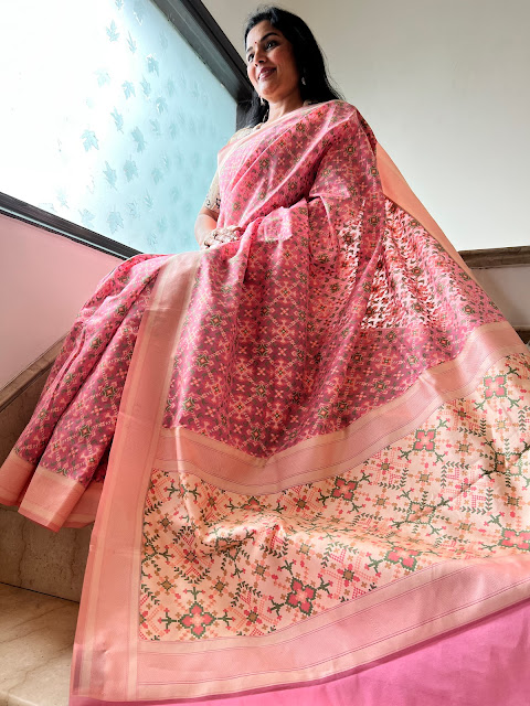 Graceful Whispers: The Pink Banarasi Cotton Saree Adorned with Navratan-inspired Patola Designs