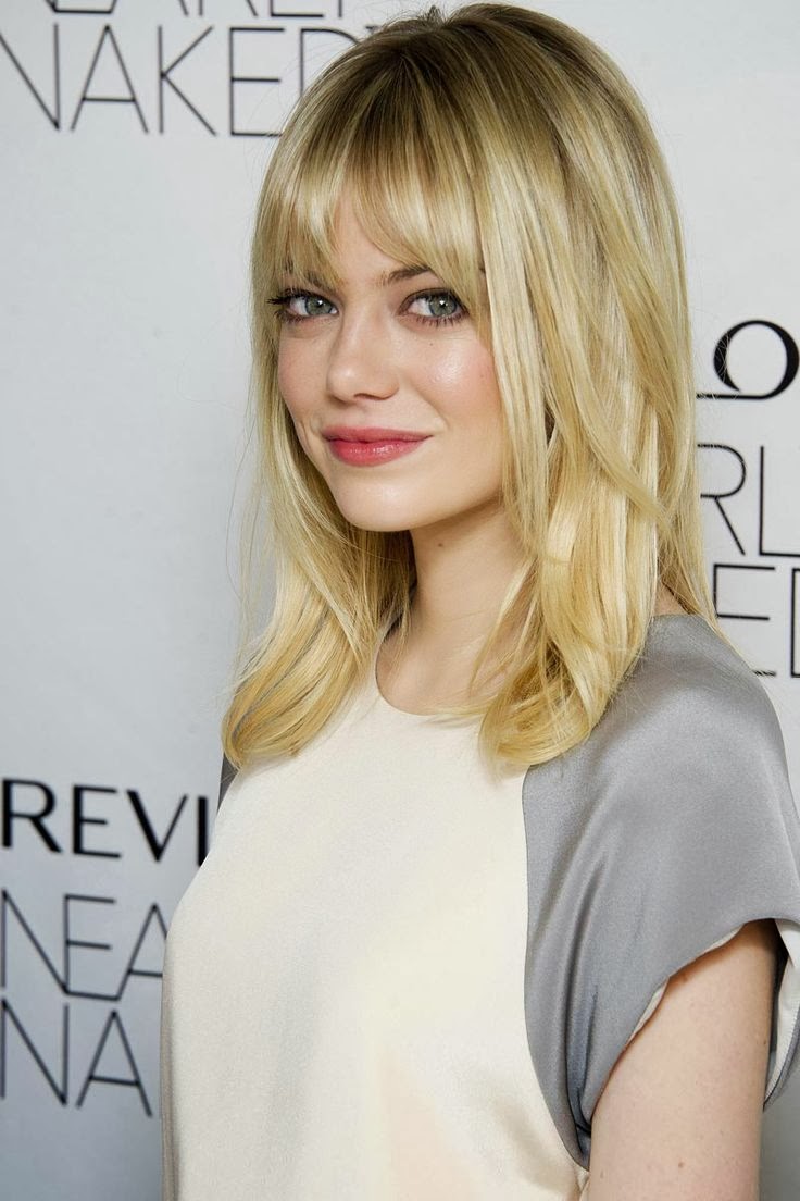 Hairstyles and Women Attire: Medium Length straight hair with bangs and