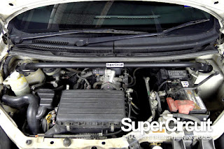 SUPERCIRCUIT Front Strut Bar installed to the engine compartment of the Perodua Viva.