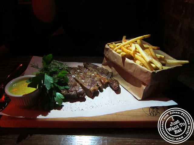 Image of Ribeye, fries and bearnaise sauce at Courgette next to Dream Hotel Midtown in NYC, New York