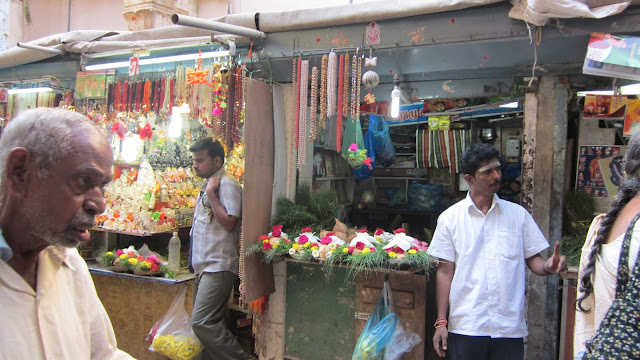 Vendors selling pooja items outside a temple in Tamil Na Vendors selling pooja items outside a temple in Tamil Na