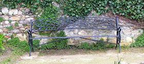 19C cast iron park bench, Descartes.  Indre et Loire, France. Photographed by Susan Walter. Tour the Loire Valley with a classic car and a private guide.