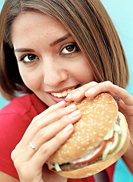 fat man eating burger. mushroom urgers and