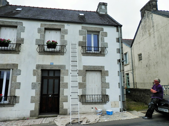 painting the exterior of an old french house