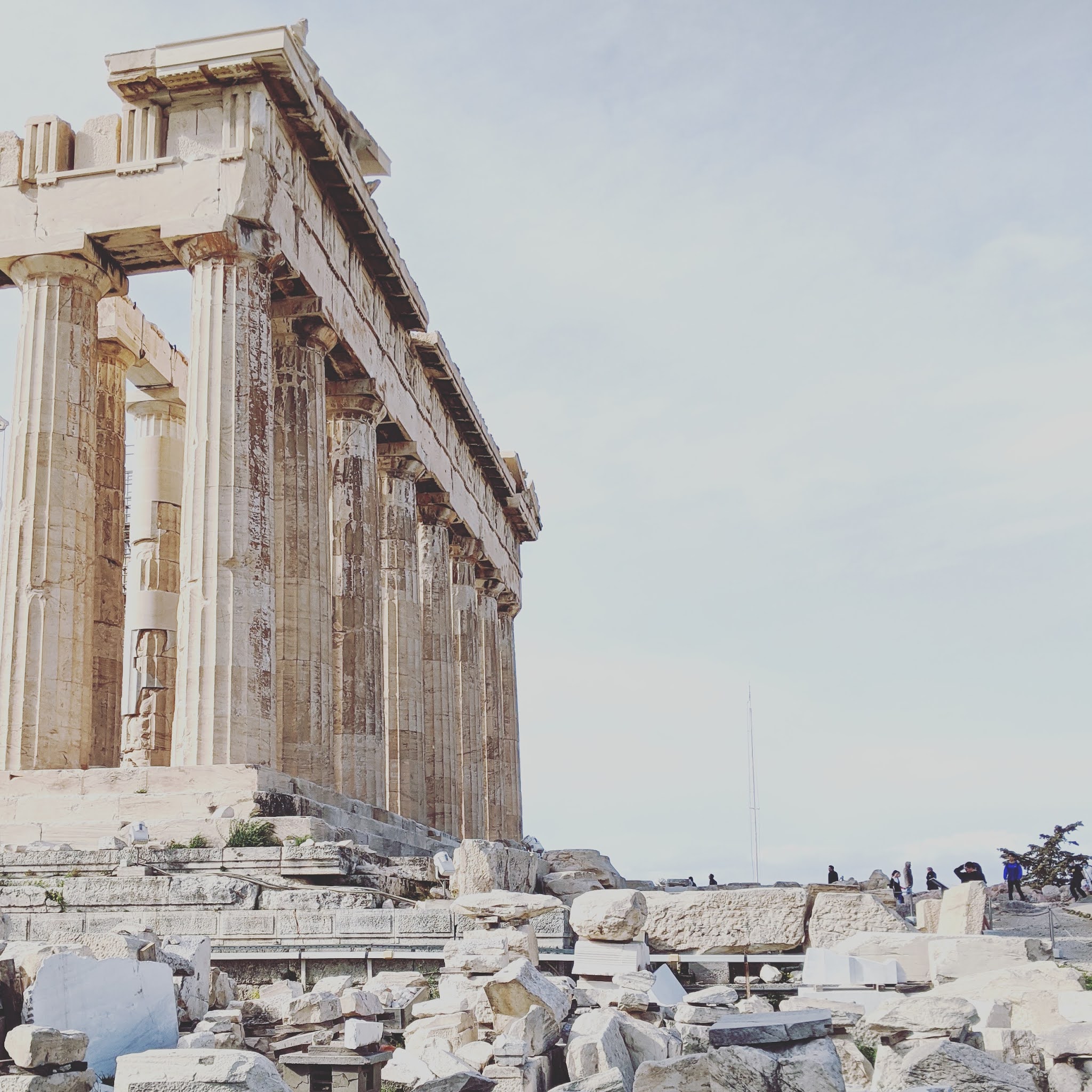 the Parthenon against a hazy sky, the ancient structure is one of the best things to see during a weekend in athens, greece